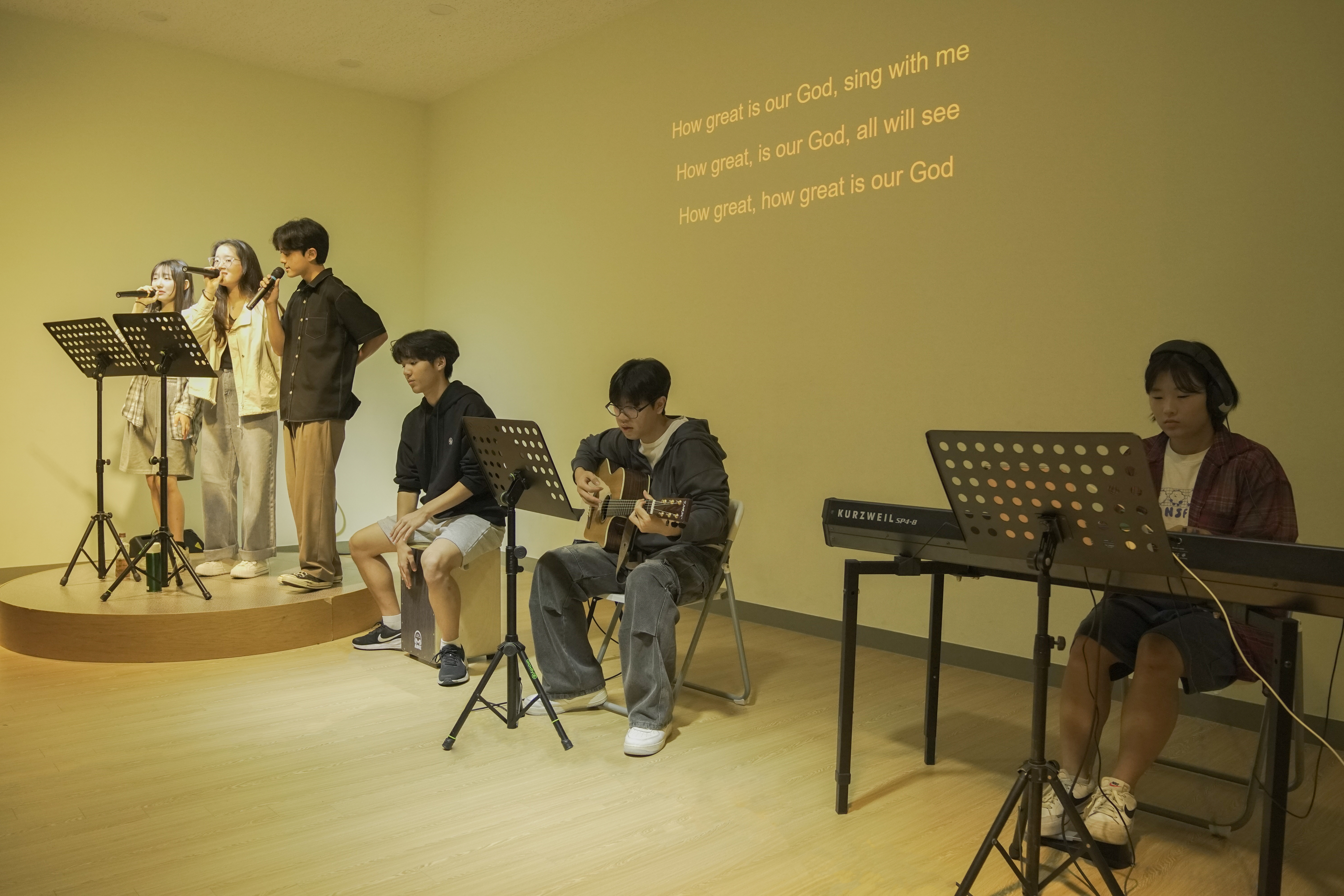 Student leading a prayer in the chapel during the Spiritual Programs